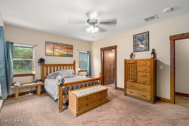 695 W Keva Ln, Athol, ID 83801 - bedroom with light colored carpet and a ceiling fan