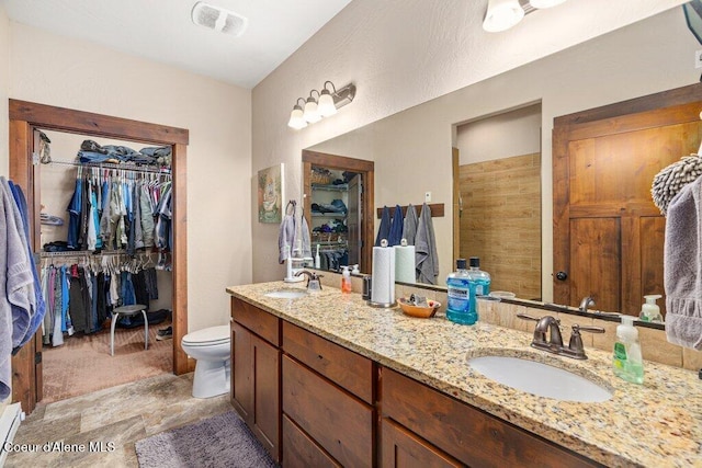 695 W Keva Ln, Athol, ID 83801 - full bath featuring double vanity, a spacious closet, and a baseboard radiator