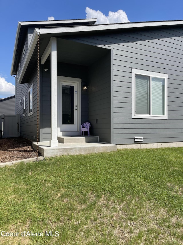 4263 N Donovan Ln, Post Falls, ID 83854 - view of exterior entry featuring a lawn and crawl space