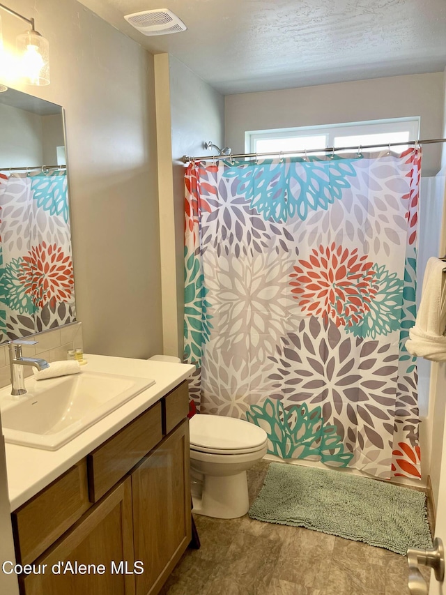 4263 N Donovan Ln, Post Falls, ID 83854 - full bathroom with vanity and a shower with shower curtain