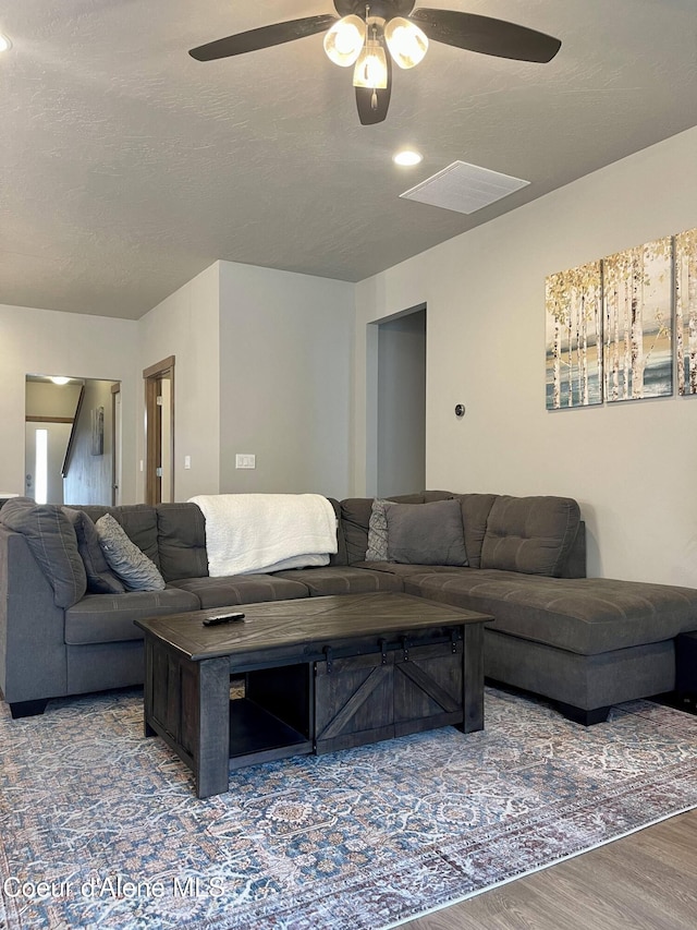 4263 N Donovan Ln, Post Falls, ID 83854 - living area with ceiling fan and wood finished floors