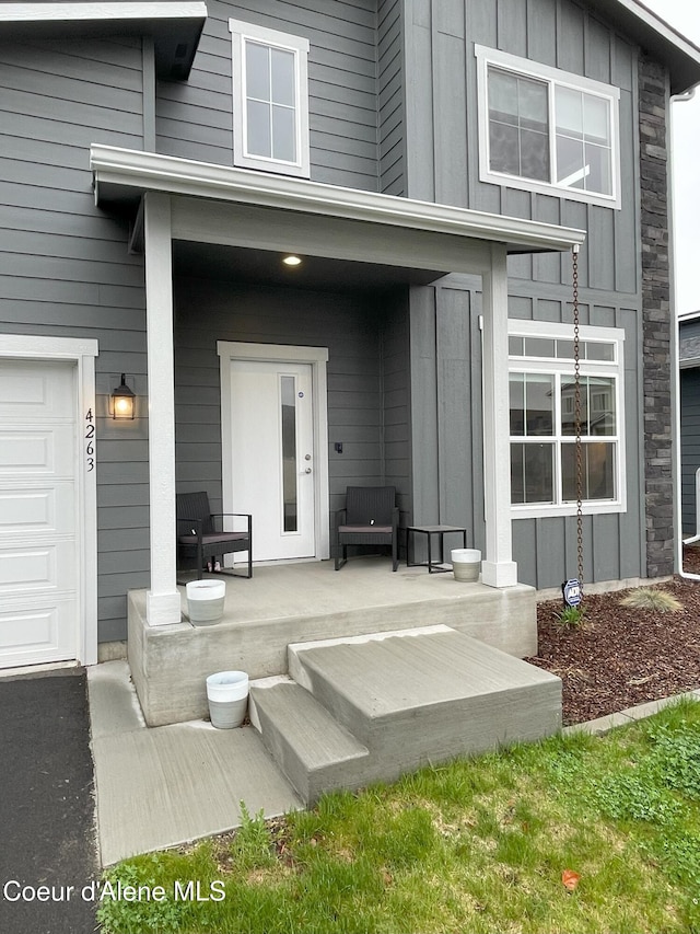 4263 N Donovan Ln, Post Falls, ID 83854 - property entrance featuring board and batten siding and covered porch