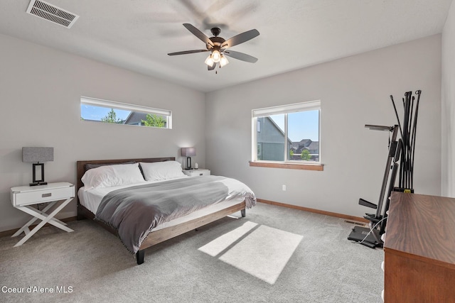 4263 N Donovan Ln, Post Falls, ID 83854 - carpeted bedroom featuring multiple windows and a ceiling fan