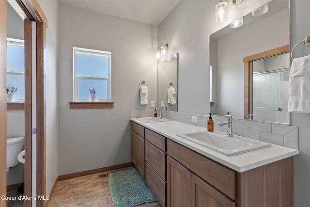 4263 N Donovan Ln, Post Falls, ID 83854 - bathroom featuring double vanity and toilet