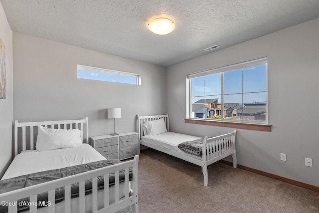 4263 N Donovan Ln, Post Falls, ID 83854 - bedroom with carpet floors and a textured ceiling