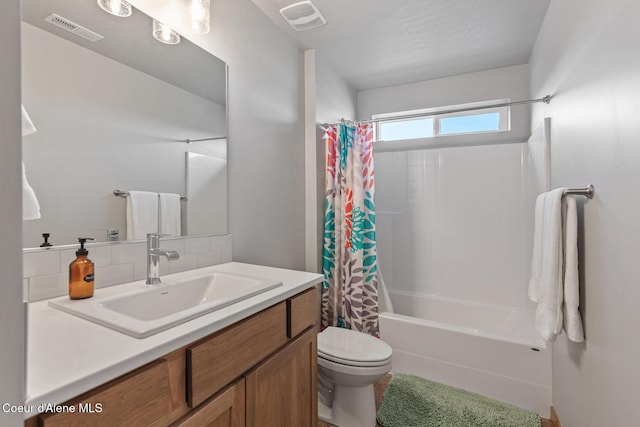 4263 N Donovan Ln, Post Falls, ID 83854 - bathroom with vanity, shower / bath combo with shower curtain, and decorative backsplash