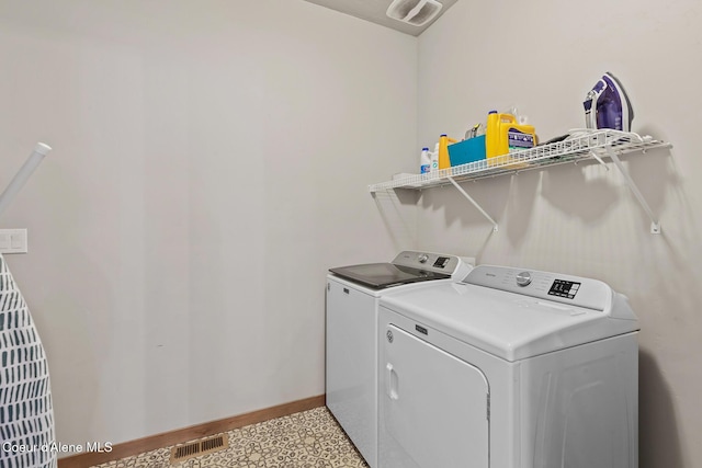 4263 N Donovan Ln, Post Falls, ID 83854 - laundry room with washing machine and clothes dryer and baseboards