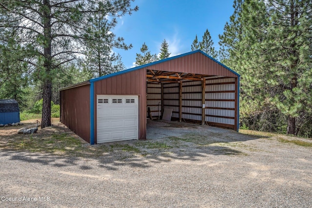 9067 W Coeur D Alene Dr, Spirit Lake, ID 83869 - garage featuring a garage