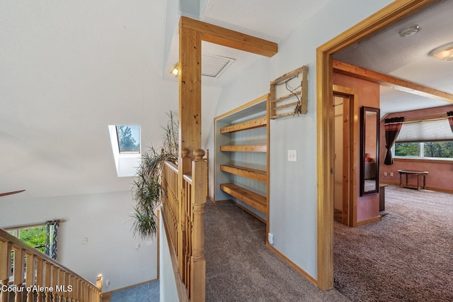 9067 W Coeur D Alene Dr, Spirit Lake, ID 83869 - stairway featuring carpet flooring, plenty of natural light, and a skylight