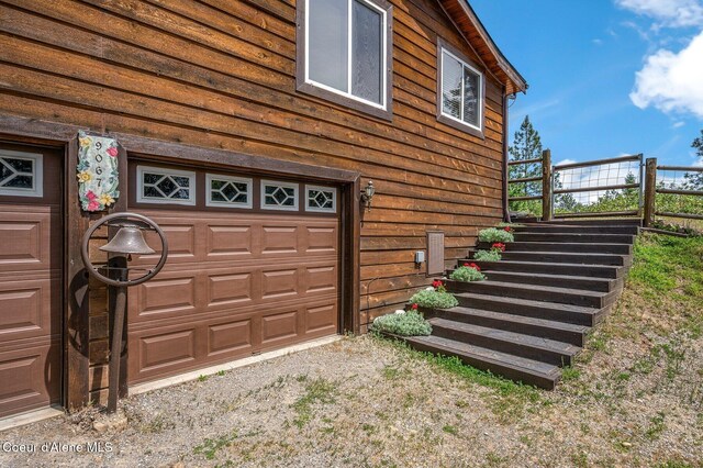 9067 W Coeur D Alene Dr, Spirit Lake, ID 83869 - garage featuring driveway