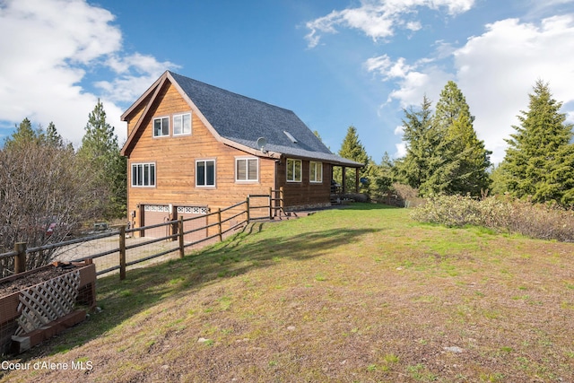 9067 W Coeur D Alene Dr, Spirit Lake, ID 83869 - view of yard with an attached garage