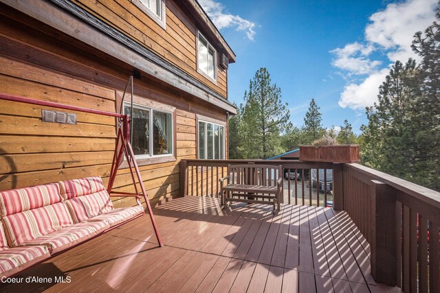 9067 W Coeur D Alene Dr, Spirit Lake, ID 83869 - wooden terrace with an outdoor living space