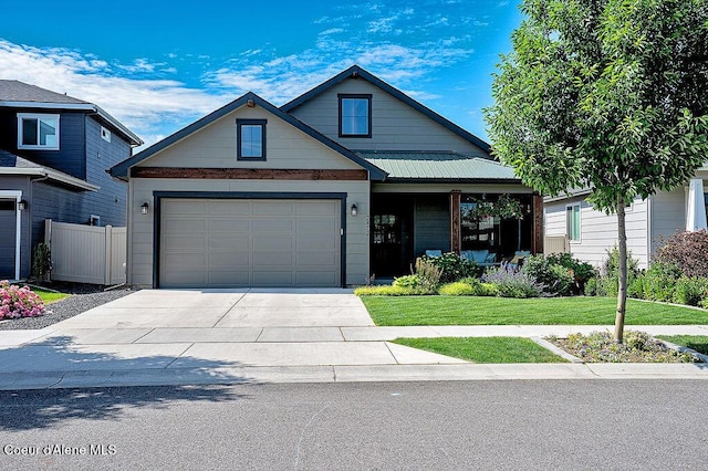 2052 W Bernard Dr, Coeur Dalene, ID 83815 - craftsman house with concrete driveway, a garage, and a porch
