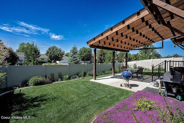 2052 W Bernard Dr, Coeur Dalene, ID 83815 - fenced backyard featuring a patio area