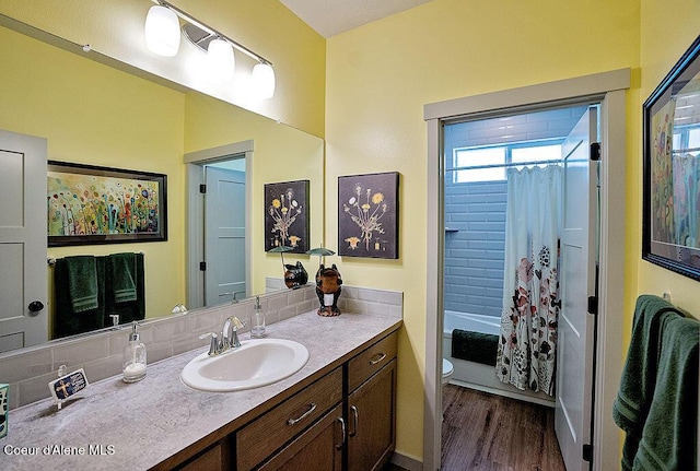 2052 W Bernard Dr, Coeur Dalene, ID 83815 - full bathroom featuring vanity, wood finished floors, and shower / bath combo