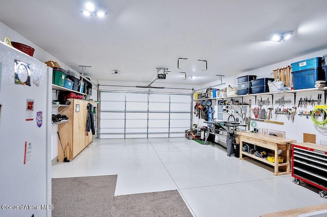 2052 W Bernard Dr, Coeur Dalene, ID 83815 - garage featuring freestanding refrigerator and a garage door opener
