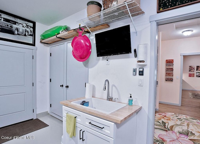 2052 W Bernard Dr, Coeur Dalene, ID 83815 - kitchen with white cabinetry and light countertops