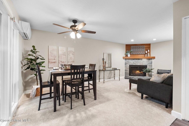 21515 N Village Blvd # 2, Rathdrum, ID 83858 - dining area with a wall mounted AC, ceiling fan, a fireplace, light carpet, and recessed lighting