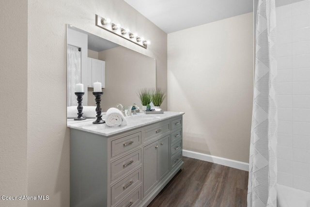 21515 N Village Blvd # 2, Rathdrum, ID 83858 - full bathroom featuring vanity, wood finished floors, and a shower with shower curtain