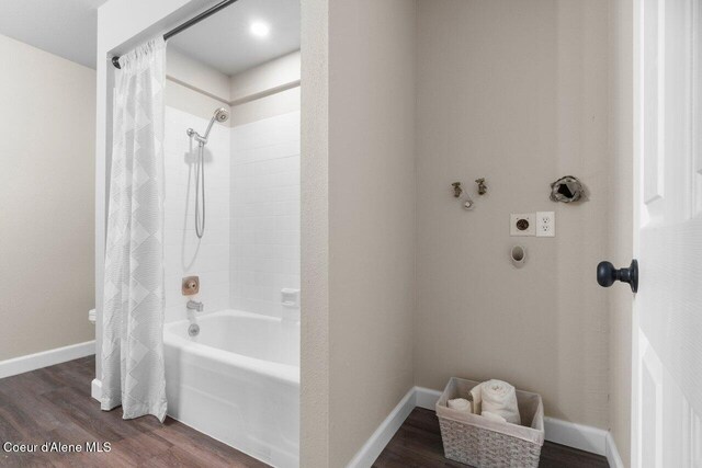21515 N Village Blvd # 2, Rathdrum, ID 83858 - bathroom with shower / bath combo and wood finished floors