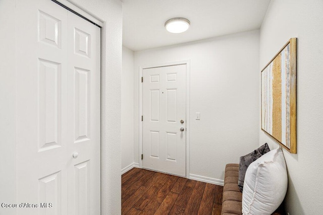 310 N Promenade Loop # 210, Post Falls, ID 83854 - doorway featuring baseboards and dark wood-type flooring