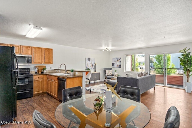 310 N Promenade Loop # 210, Post Falls, ID 83854 - dining area with dark wood-type flooring and a textured ceiling