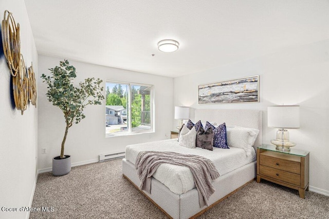 310 N Promenade Loop # 210, Post Falls, ID 83854 - bedroom with a baseboard radiator and carpet flooring