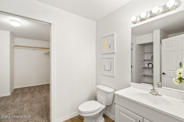 310 N Promenade Loop # 210, Post Falls, ID 83854 - bathroom featuring vanity and a walk in closet