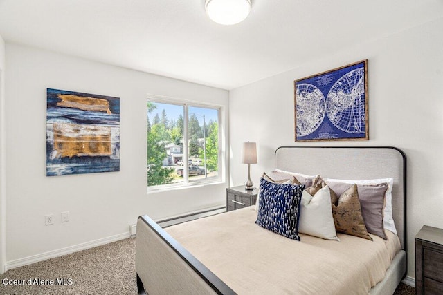 310 N Promenade Loop # 210, Post Falls, ID 83854 - carpeted bedroom with a baseboard heating unit and baseboards