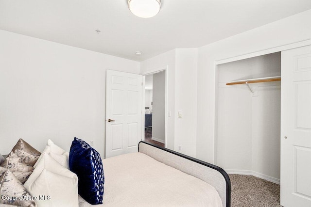 310 N Promenade Loop # 210, Post Falls, ID 83854 - carpeted bedroom with baseboards and a closet