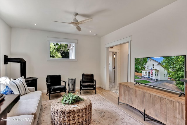 917 N Boyer Ave, Sandpoint, ID 83864 - living area featuring ceiling fan, a wood stove, wood finished floors, and recessed lighting