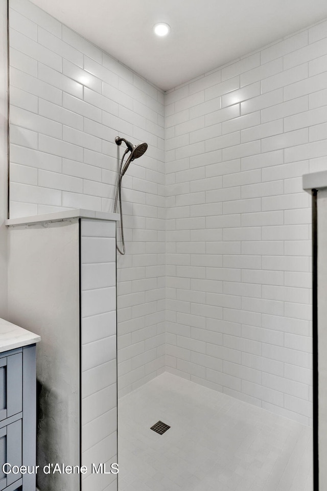 917 N Boyer Ave, Sandpoint, ID 83864 - bathroom with tiled shower, vanity, and recessed lighting