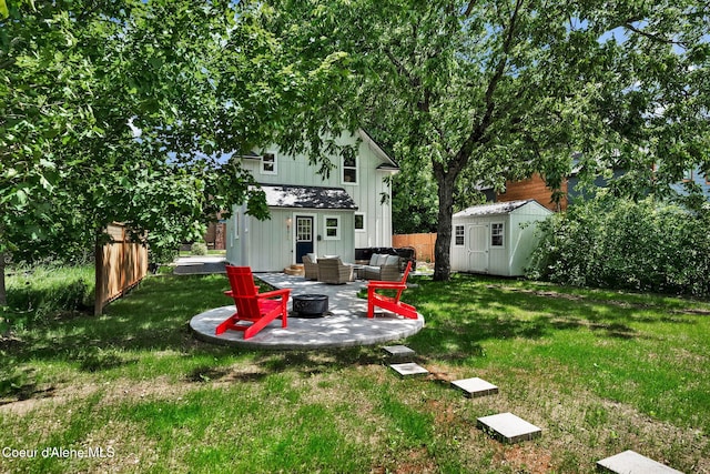 917 N Boyer Ave, Sandpoint, ID 83864 - view of yard with an outdoor living space with a fire pit, a patio area, and a storage shed