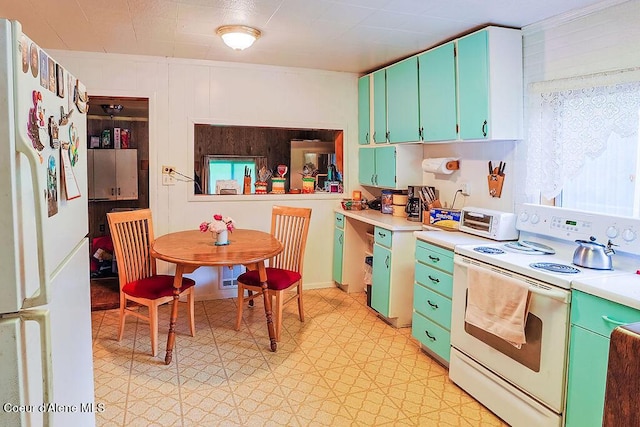164 W Fork Pine Creek Rd, Pinehurst, ID 83850 - kitchen featuring white appliances, light countertops, and light floors