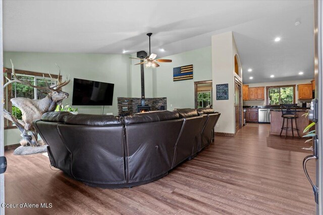 438 Berry Hl, Cocolalla, ID 83813 - living room with wood finished floors, vaulted ceiling, ceiling fan, a wood stove, and recessed lighting