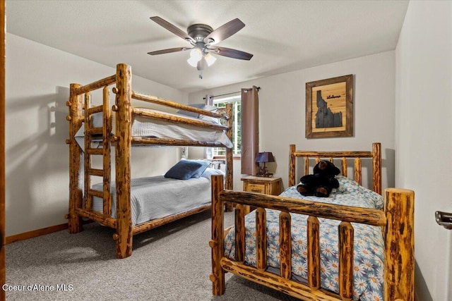 438 Berry Hl, Cocolalla, ID 83813 - carpeted bedroom featuring a ceiling fan and baseboards