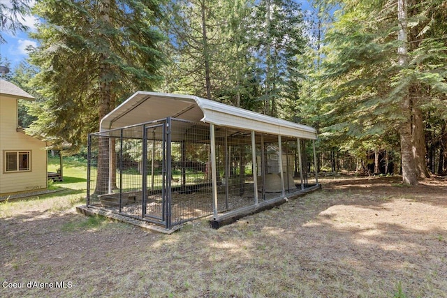 438 Berry Hl, Cocolalla, ID 83813 - view of yard featuring an outbuilding, a detached carport, and an exterior structure