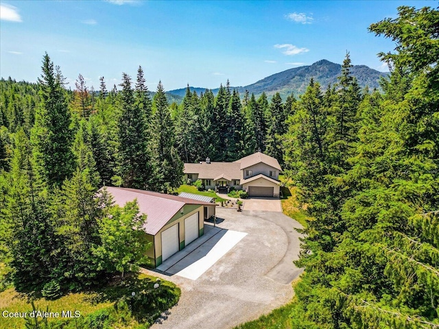 438 Berry Hl, Cocolalla, ID 83813 - view of subject property with a mountain backdrop and a heavily wooded area