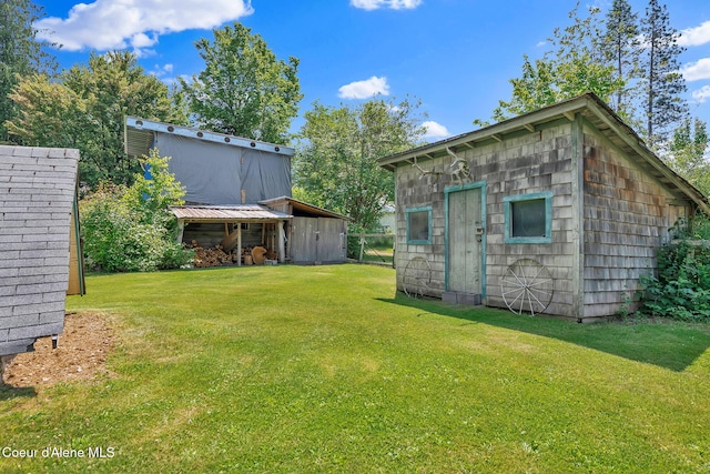 498 Lakeview Rd, Bayview, ID 83803 - view of grassy yard with an outdoor structure