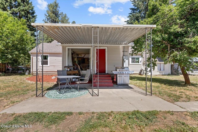 2224 E Coeur D Alene Ave, Coeur Dalene, ID 83814 - view of front of house featuring a patio area and a front lawn