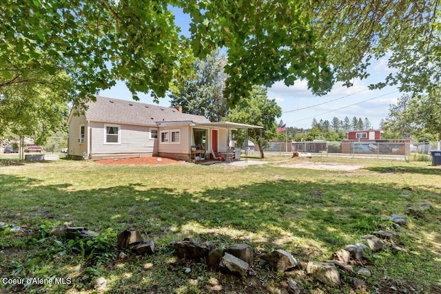 2224 E Coeur D Alene Ave, Coeur Dalene, ID 83814 - rear view of house featuring a patio and a chimney