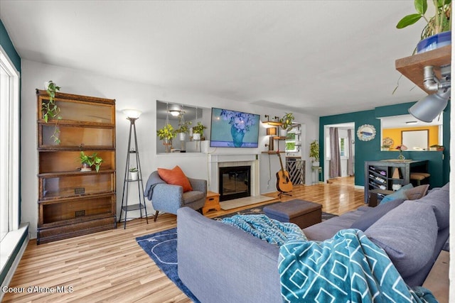 2224 E Coeur D Alene Ave, Coeur Dalene, ID 83814 - living area with wood finished floors and a fireplace with flush hearth
