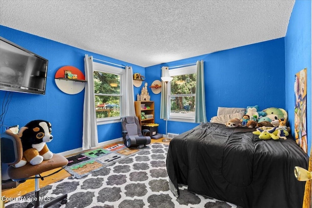 2224 E Coeur D Alene Ave, Coeur Dalene, ID 83814 - bedroom with a textured ceiling and baseboards