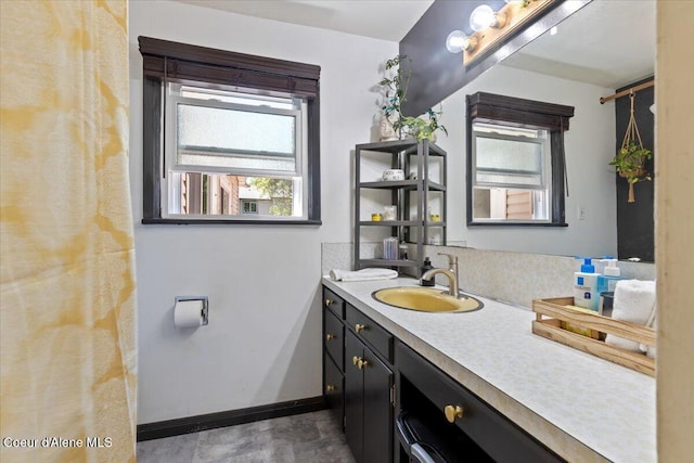 2224 E Coeur D Alene Ave, Coeur Dalene, ID 83814 - full bath featuring vanity and baseboards