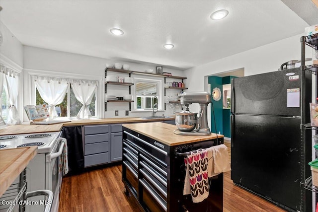 2224 E Coeur D Alene Ave, Coeur Dalene, ID 83814 - kitchen featuring freestanding refrigerator, wood counters, gray cabinetry, open shelves, and electric stove