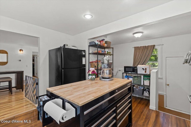 2224 E Coeur D Alene Ave, Coeur Dalene, ID 83814 - kitchen featuring black appliances and wood finished floors