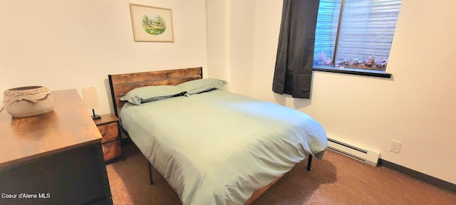 610 W Emma Ave, Coeur Dalene, ID 83814 - bedroom featuring a baseboard heating unit and carpet floors