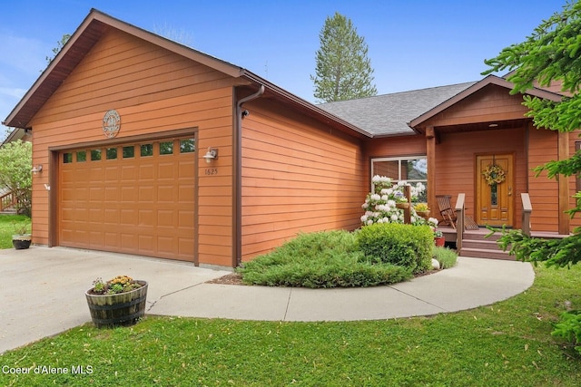 1625 Sequoia, Sandpoint, ID 83864 - view of front of house featuring driveway, an attached garage, and roof with shingles