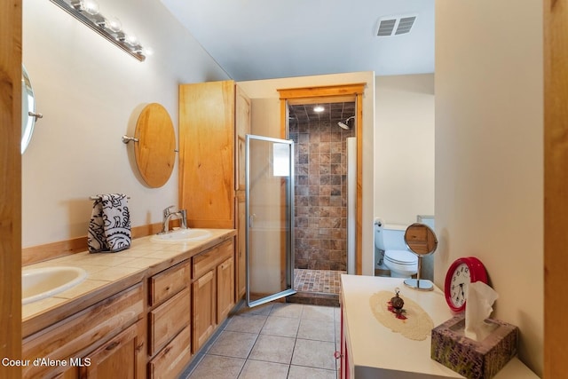 1625 Sequoia, Sandpoint, ID 83864 - bathroom with double vanity, a stall shower, and tile patterned flooring