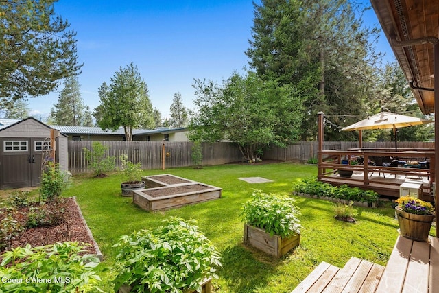 1625 Sequoia, Sandpoint, ID 83864 - fenced backyard with a garden, a storage unit, and a deck